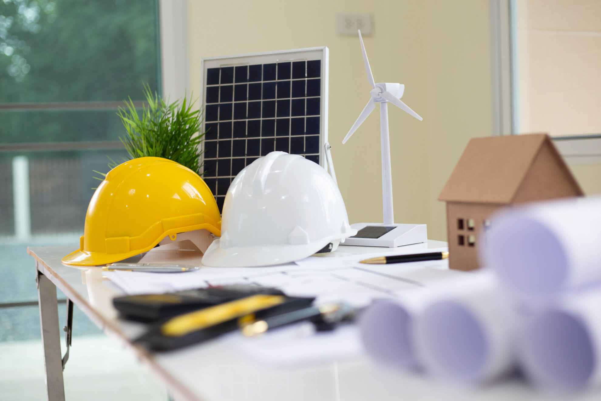 Desk of Architectural working project in construction site,With drawing equipment concept.